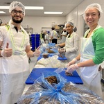 Toronto 2024 Articling Students preparing food while volunteering at the Daily Bread Food Bank